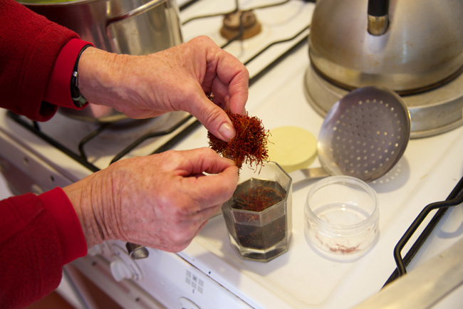 adding the saffron to the raisins soaking water